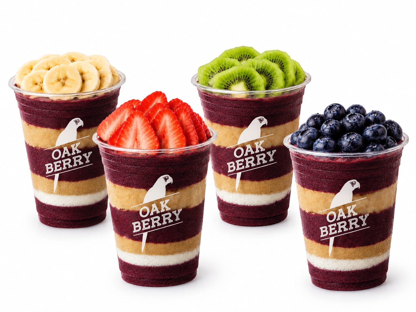 Cuatro bowls de açaí OAKBERRY con banano, fresas, kiwi y arándanos